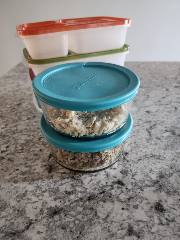 Meal prep containers full of food preparing for the week ahead.