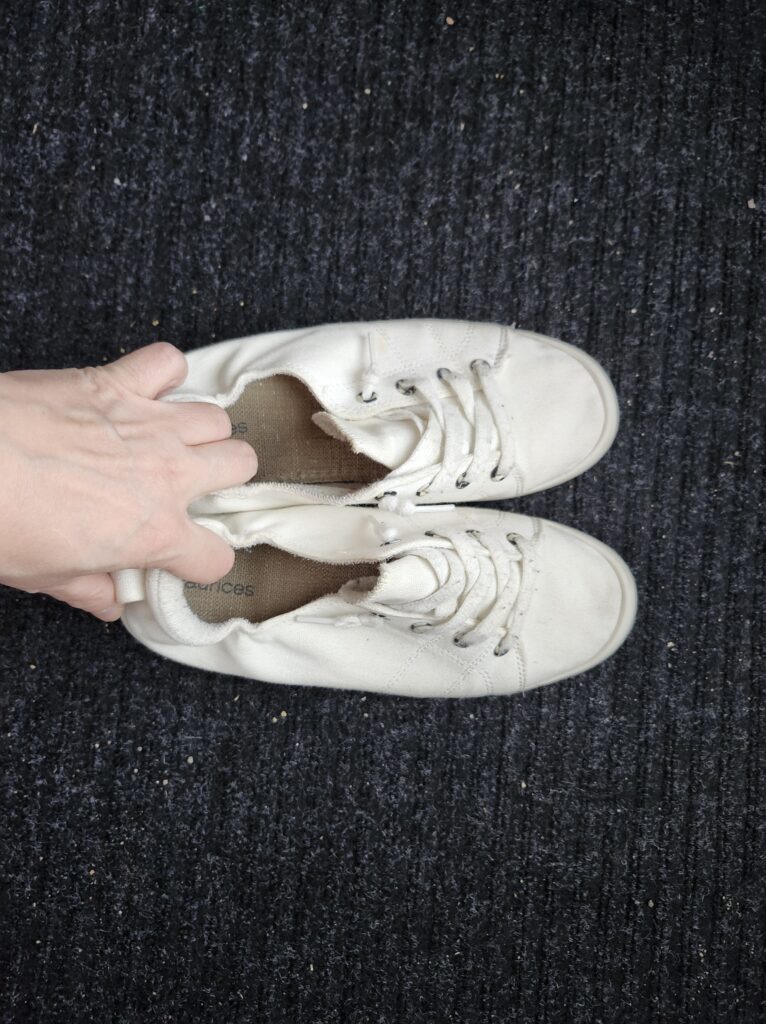 Pair of white walking shoes ready to go for a walk