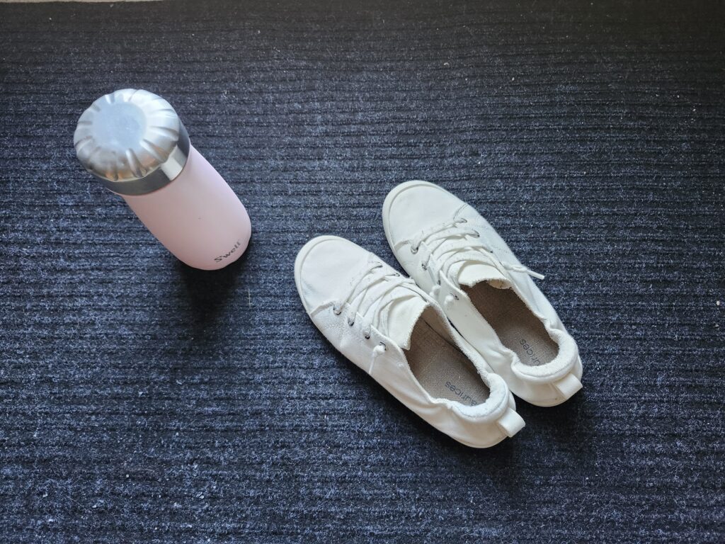 Walking shoes and a water bottle ready to go for a walk