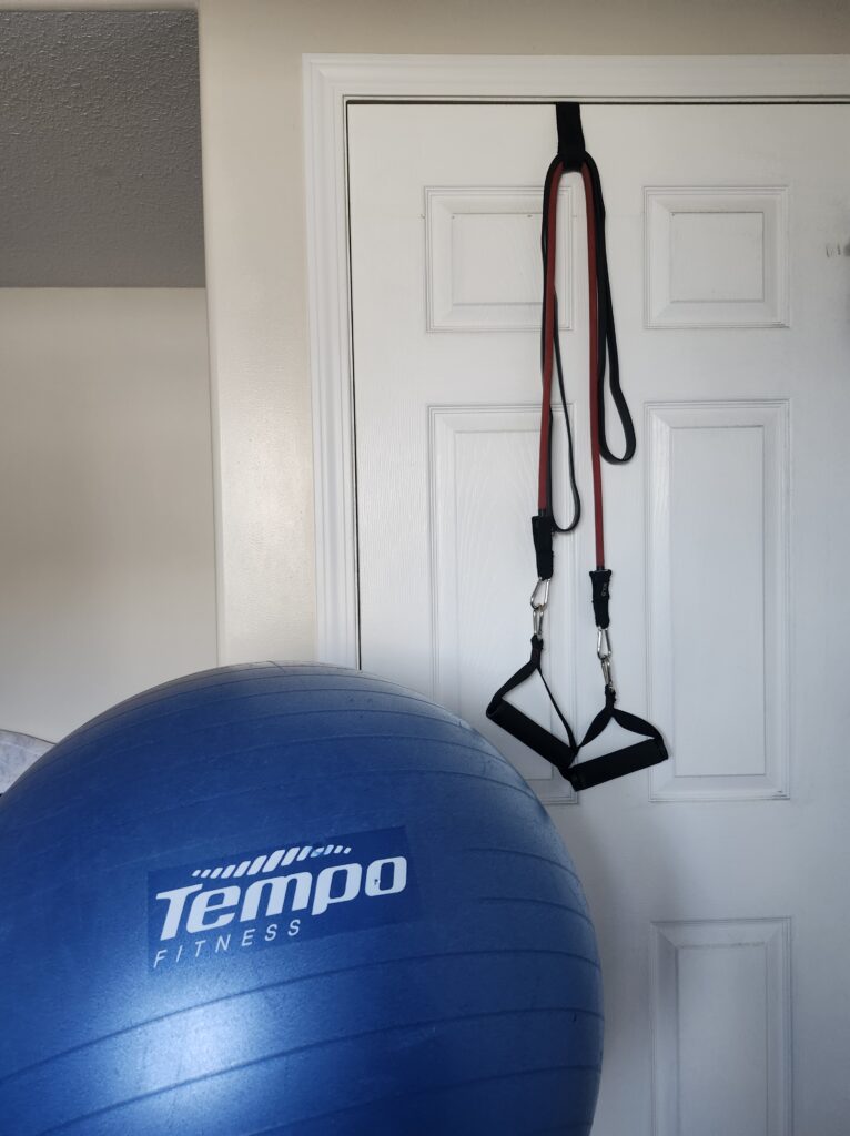 Reistance bands on a doorway setup with a ball ready to workout