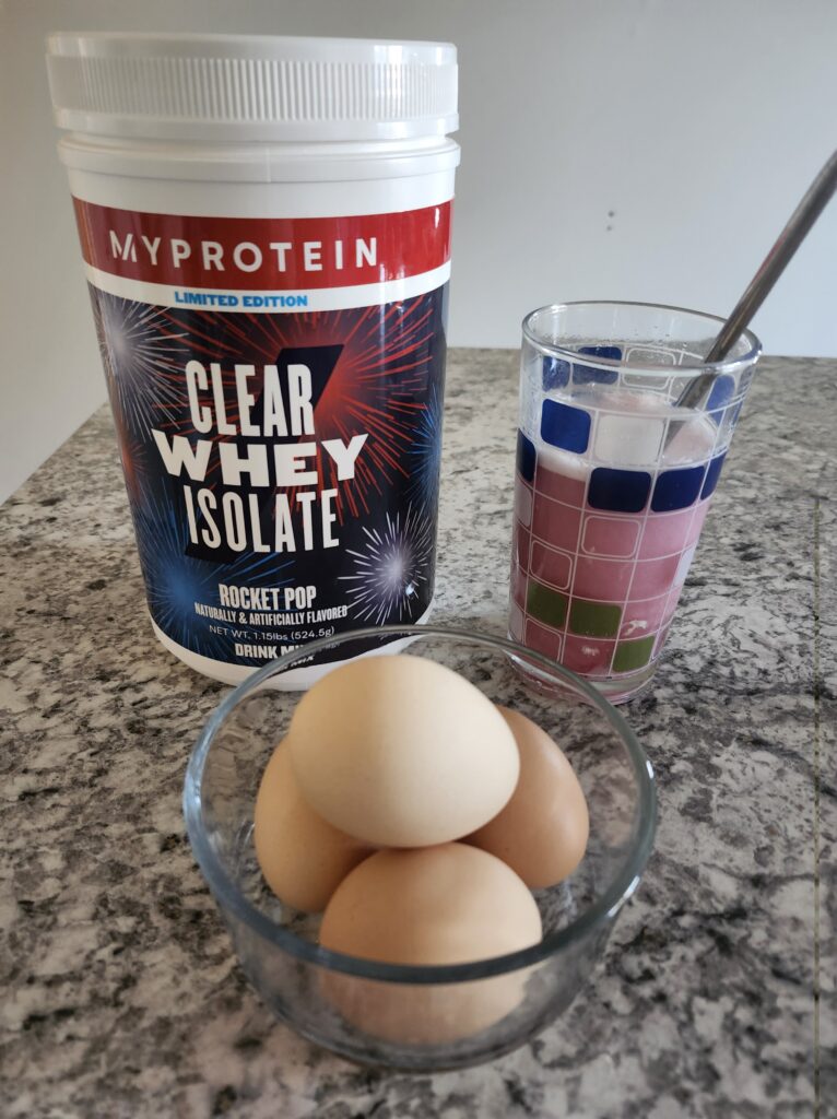 Protein powder and it mixed up with some eggs on the counter