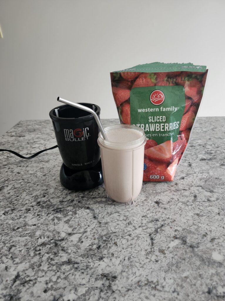 Protein powder and strawberries bleneded up for a quick breakfast idea